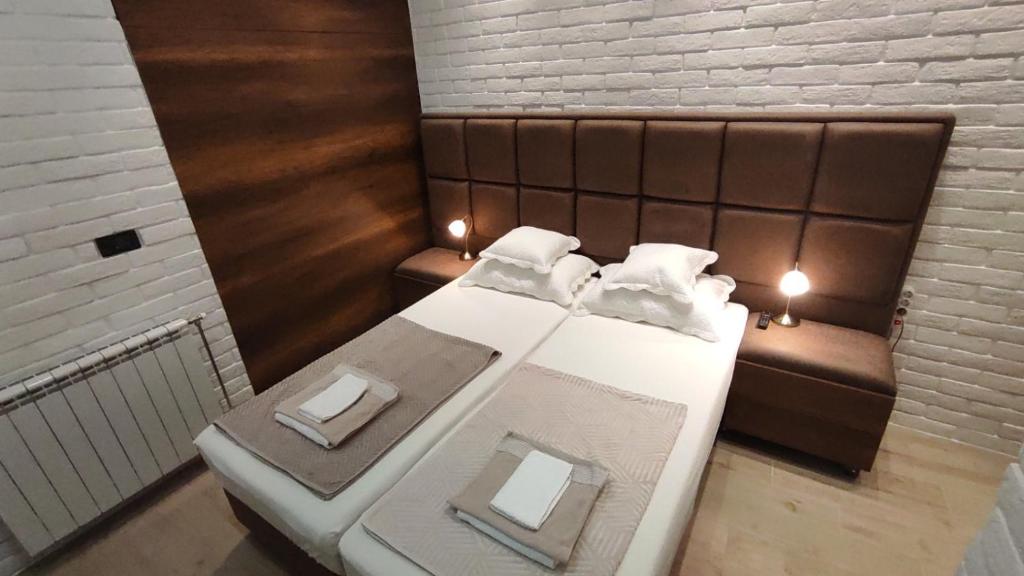 a small room with a bed and a couch at Sky is the limit * Novi Sad * in Novi Sad