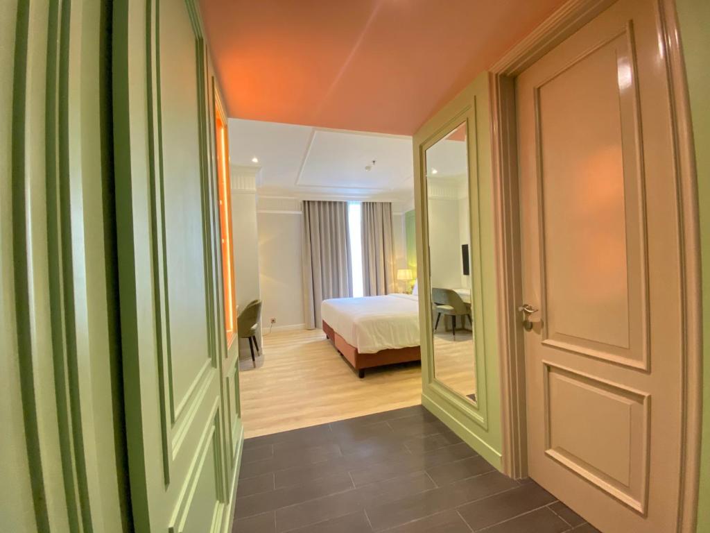 Postel nebo postele na pokoji v ubytování Maia Hotel Jakarta