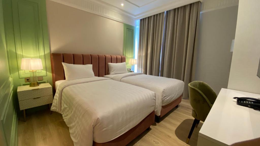 Postel nebo postele na pokoji v ubytování Maia Hotel Jakarta