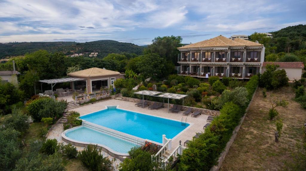 an aerial view of a house with a swimming pool at Spiti Marias by Thanos Village in Gialova