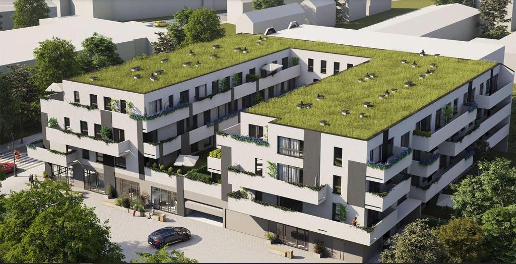 an image of a building with a grass roof at Apartament centrum in Ciechocinek