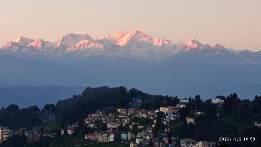a view of a city with mountains in the background at Blue Horizon Homestay in Darjeeling
