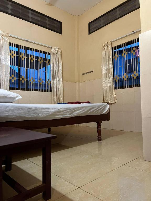 Postel nebo postele na pokoji v ubytování Ta Eng Guesthouse