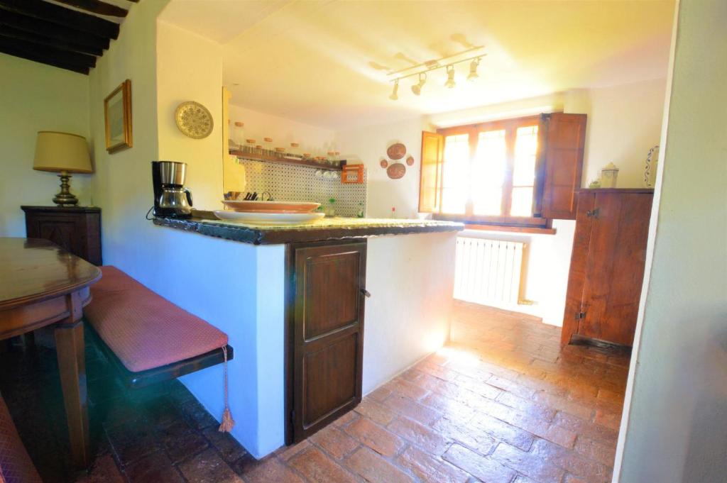 Kuchyňa alebo kuchynka v ubytovaní La Migliana by Nicola Real Estate