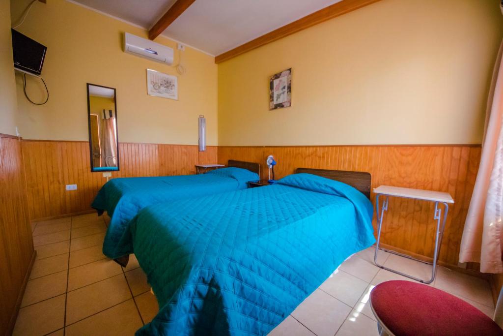 Postel nebo postele na pokoji v ubytování Hotel Montecarlo