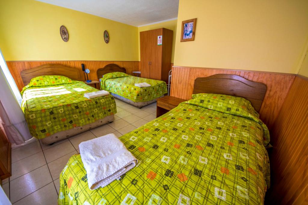 Postel nebo postele na pokoji v ubytování Hotel Montecarlo