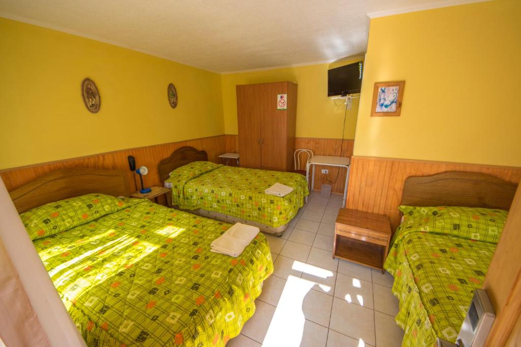 Postel nebo postele na pokoji v ubytování Hotel Montecarlo