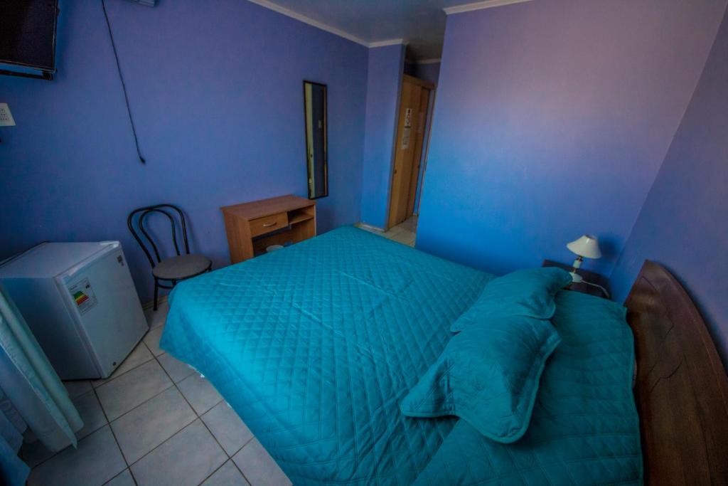 Postel nebo postele na pokoji v ubytování Hotel Montecarlo