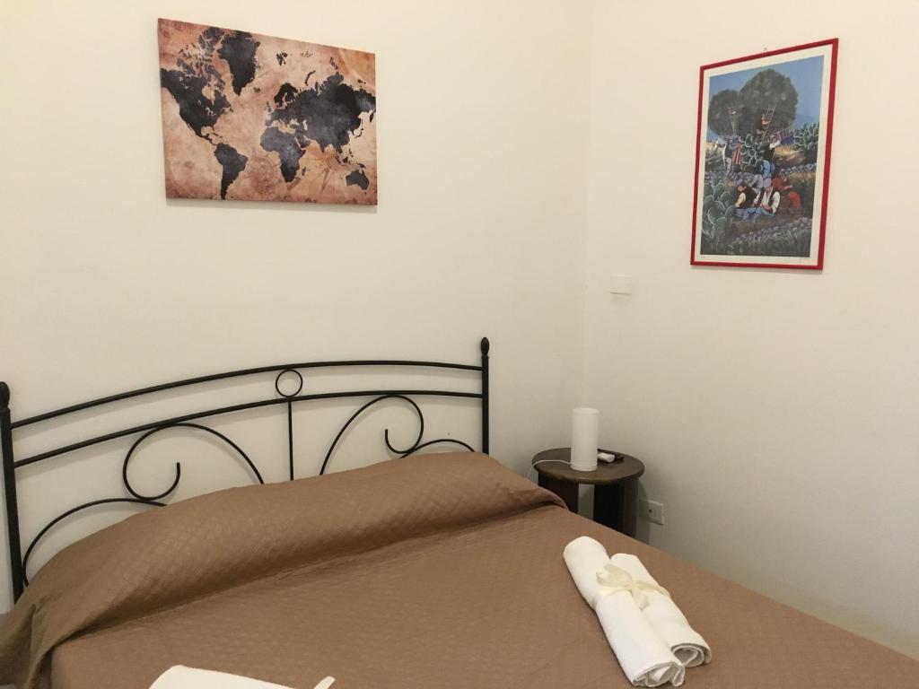 Letto o letti in una camera di Le stanze di Regina Margherita