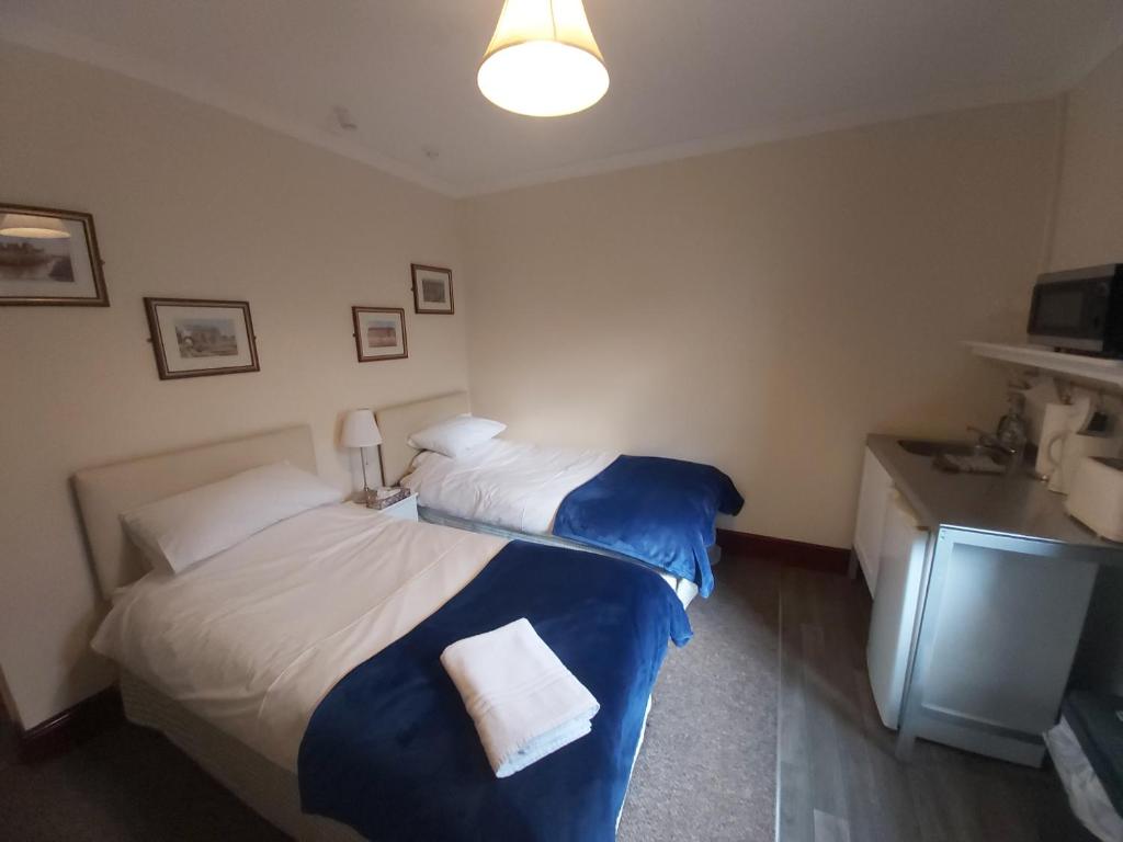 Postel nebo postele na pokoji v ubytování Sergeants Accommodation