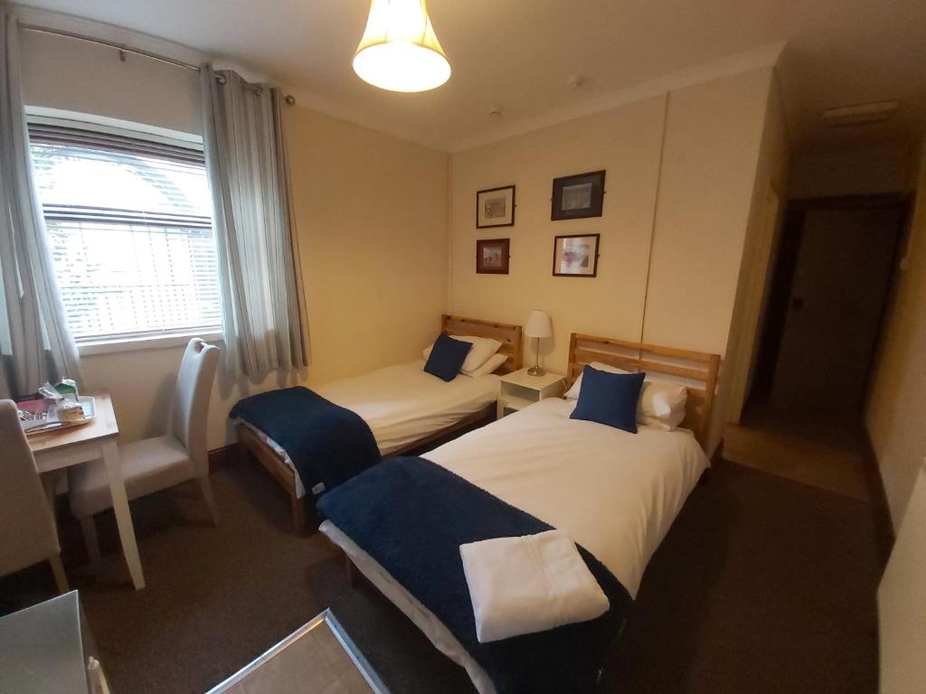 Postel nebo postele na pokoji v ubytování Sergeants Accommodation