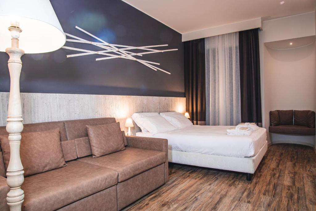 Postel nebo postele na pokoji v ubytování Hotel Universal