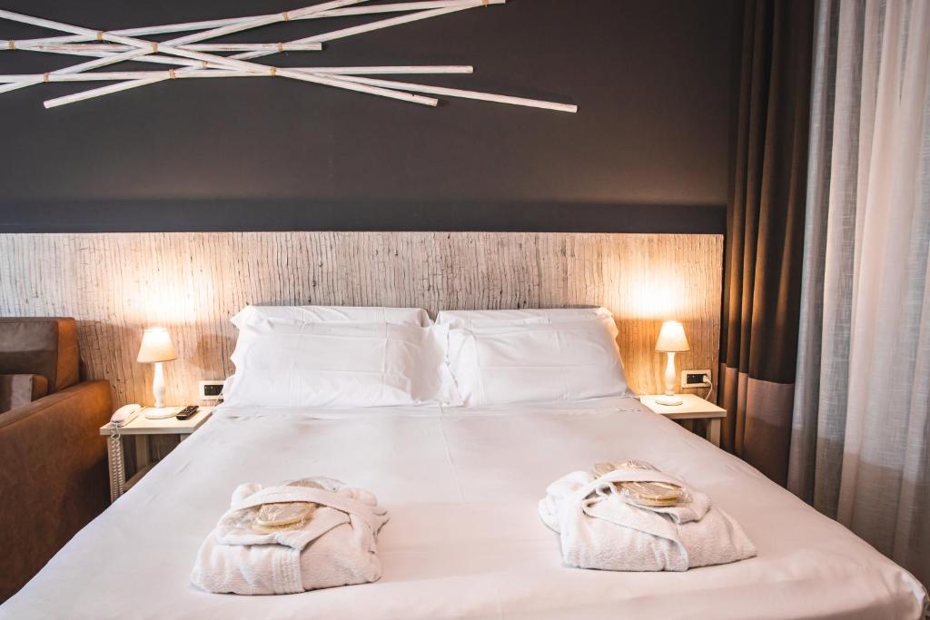 Postel nebo postele na pokoji v ubytování Hotel Universal