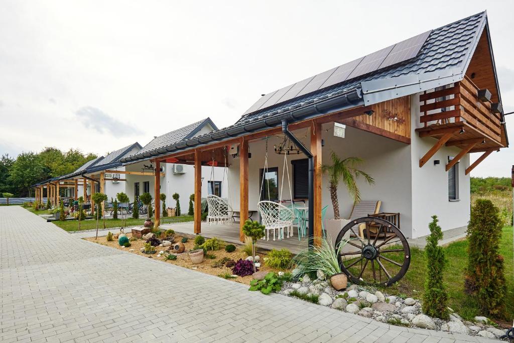 a house with a solar roof on it at Zatoka Perska - dom GREK nad jeziorem Tarnobrzeskim in Tarnobrzeg