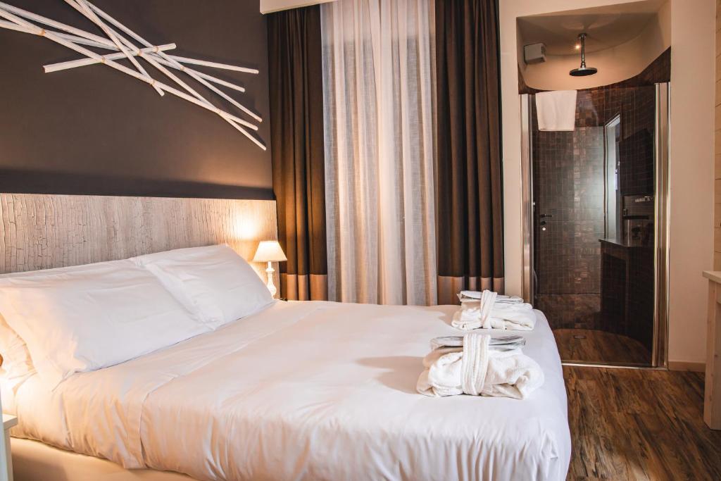 Postel nebo postele na pokoji v ubytování Hotel Universal