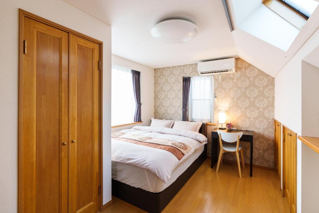 Postel nebo postele na pokoji v ubytování Luxury Guest House in Tokyo Shinjuku