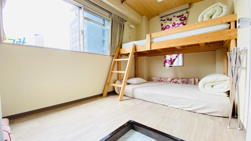 Postel nebo postele na pokoji v ubytování GUEST HOUSE B's FiveⅡ