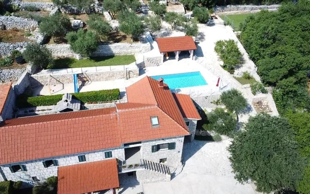 an aerial view of a house with a swimming pool at Antini dvori in Imotski