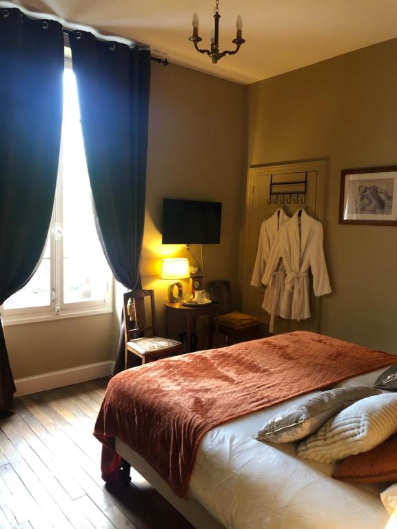 Postel nebo postele na pokoji v ubytování Maison de la Comtesse