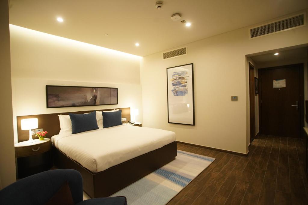 Postel nebo postele na pokoji v ubytování C - Hotel and Suites Doha