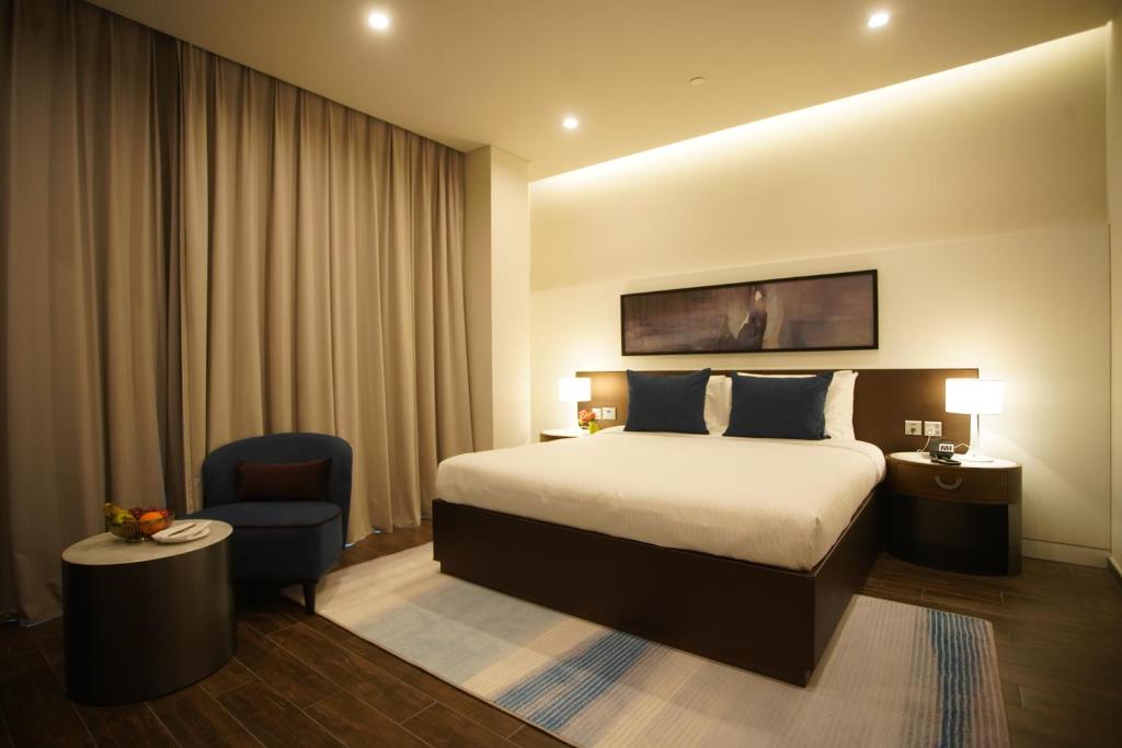 Postel nebo postele na pokoji v ubytování C - Hotel and Suites Doha
