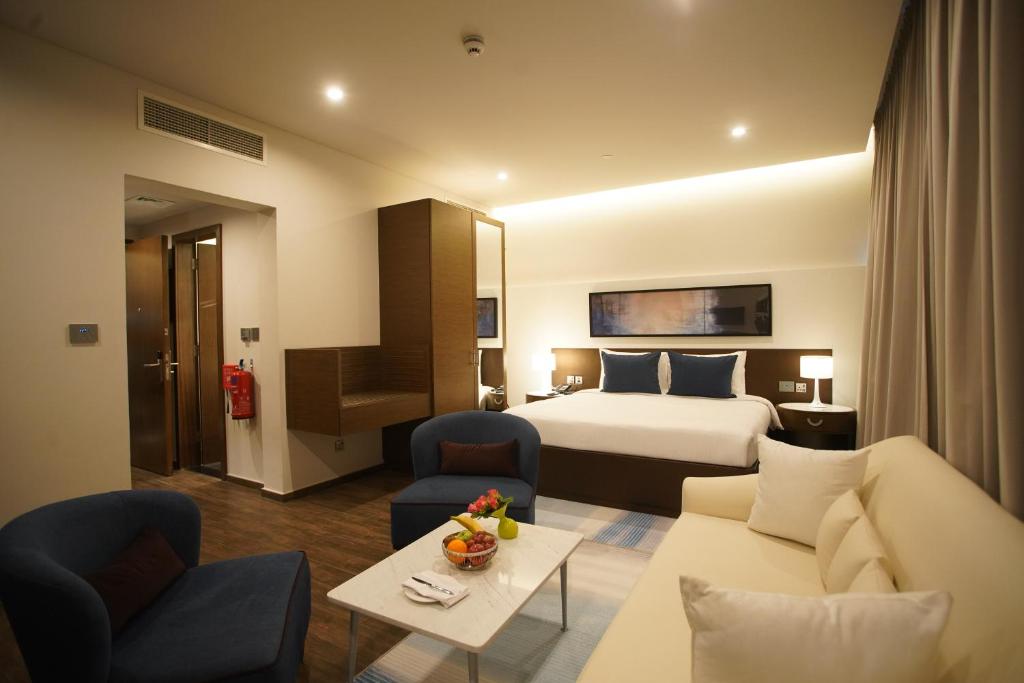 Postel nebo postele na pokoji v ubytování C - Hotel and Suites Doha