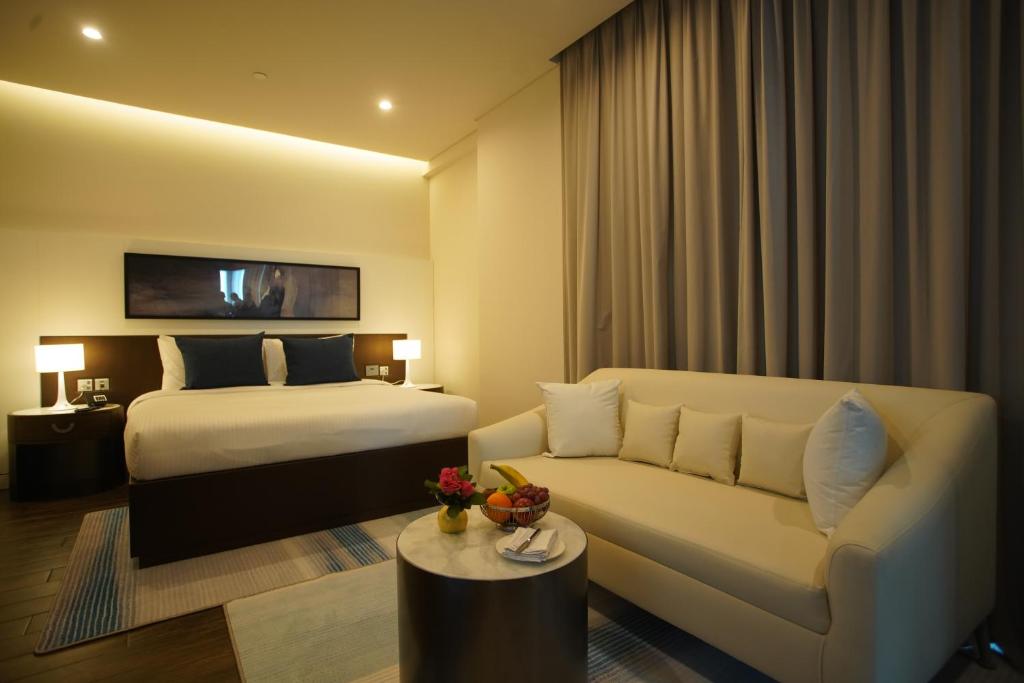 Postel nebo postele na pokoji v ubytování C - Hotel and Suites Doha