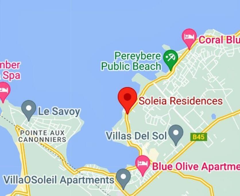 a map of the beach with a red marker at Joli appartement neuf 2ch 2sdb 50m de la mer in Grand-Baie