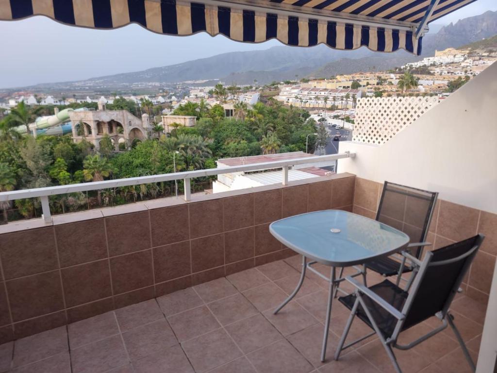 a balcony with a table and chairs and a view at Malibu Ocean View in Adeje