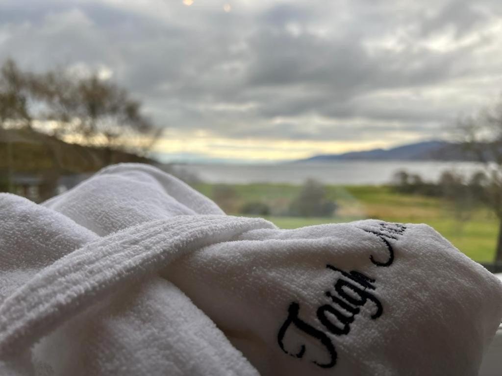 a person wrapped in a towel with the word bed written on it at Taigh Mara(Marine House) 2 bed Apartment in Fort William