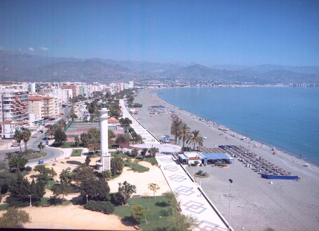 a view of a beach with a city and the ocean at APCOSTAS - Torre del Mar Playa in Torre del Mar