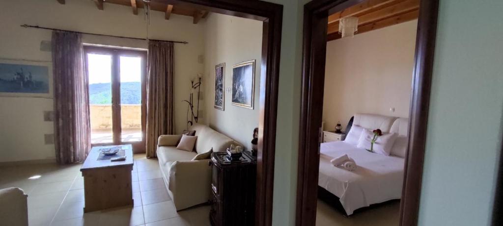 A bed or beds in a room at Vasiliki's Residence - Breathtaking View