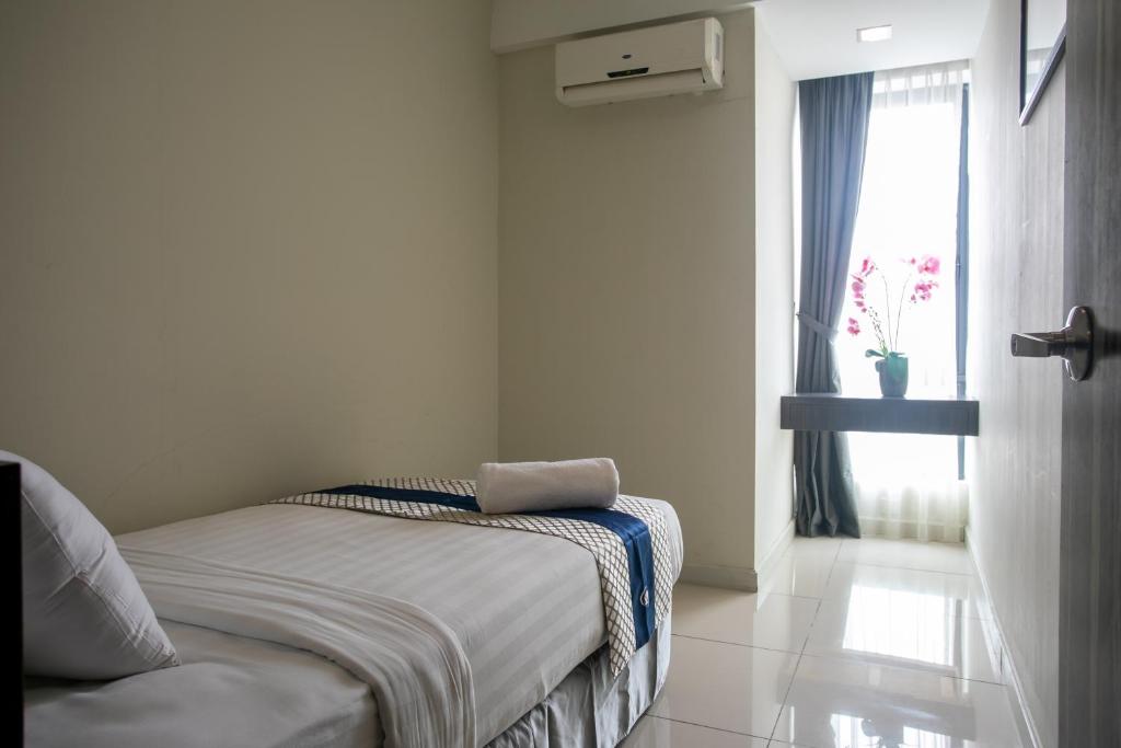 Postel nebo postele na pokoji v ubytování Sky Hotel