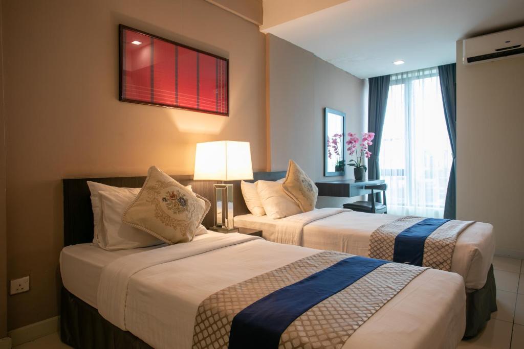 Postel nebo postele na pokoji v ubytování Sky Hotel