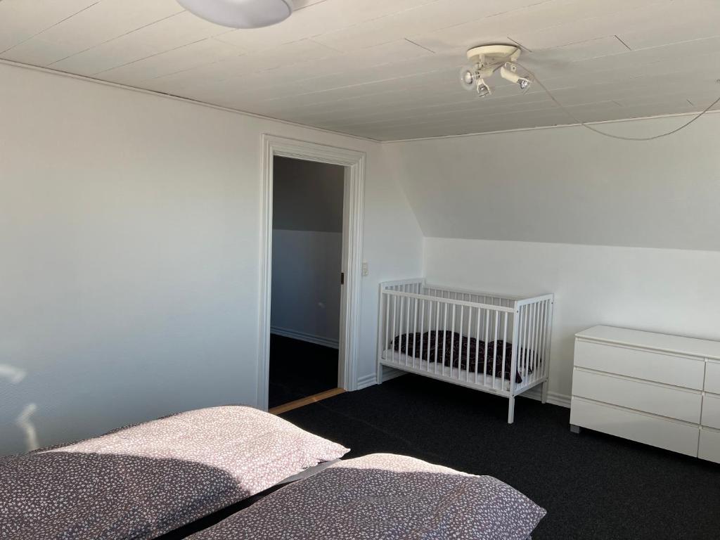 Postel nebo postele na pokoji v ubytování Hyggeligt byhus