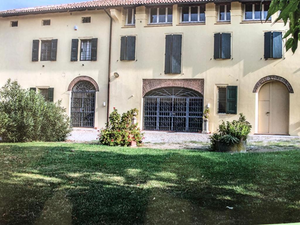 a large house with a yard in front of it at La Tenuta di Leo in San Giovanni in Persiceto