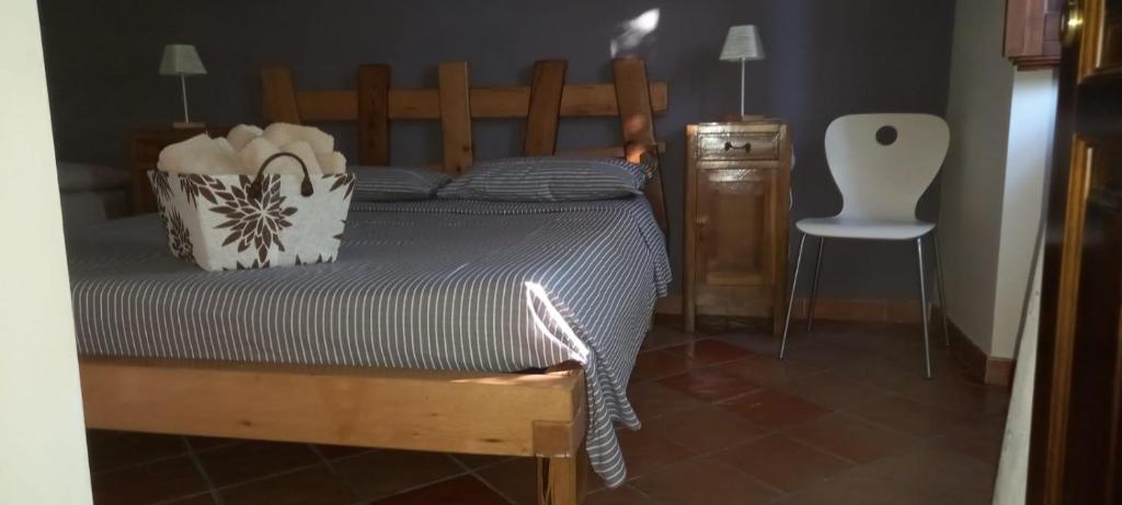 Łóżko lub łóżka w pokoju w obiekcie azienda agrituristica la torretta