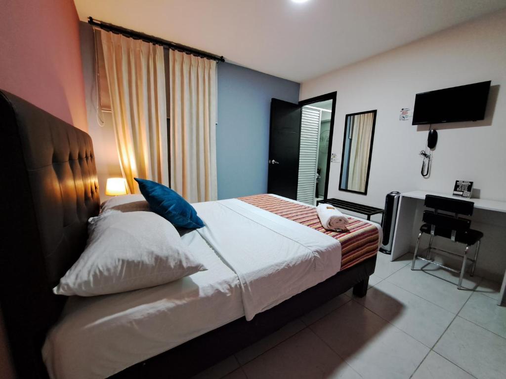 Postel nebo postele na pokoji v ubytování Hotel 9-25