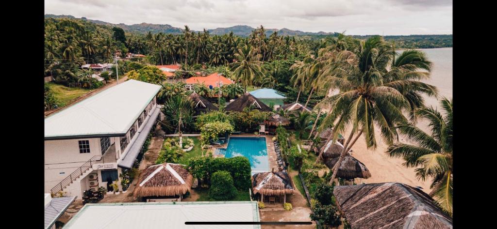 an aerial view of a resort with a swimming pool at Suite Princess Beach Resort in Siquijor