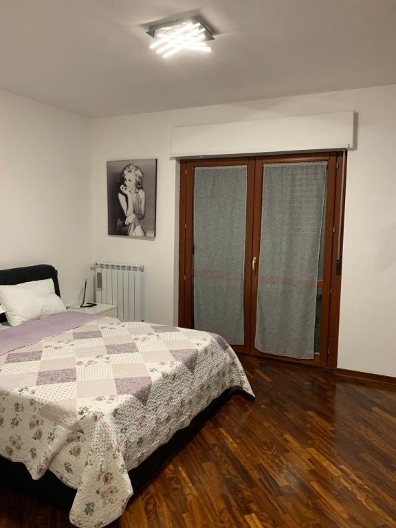 Casa Blues Parco Leonardo tesisinde bir odada yatak veya yataklar