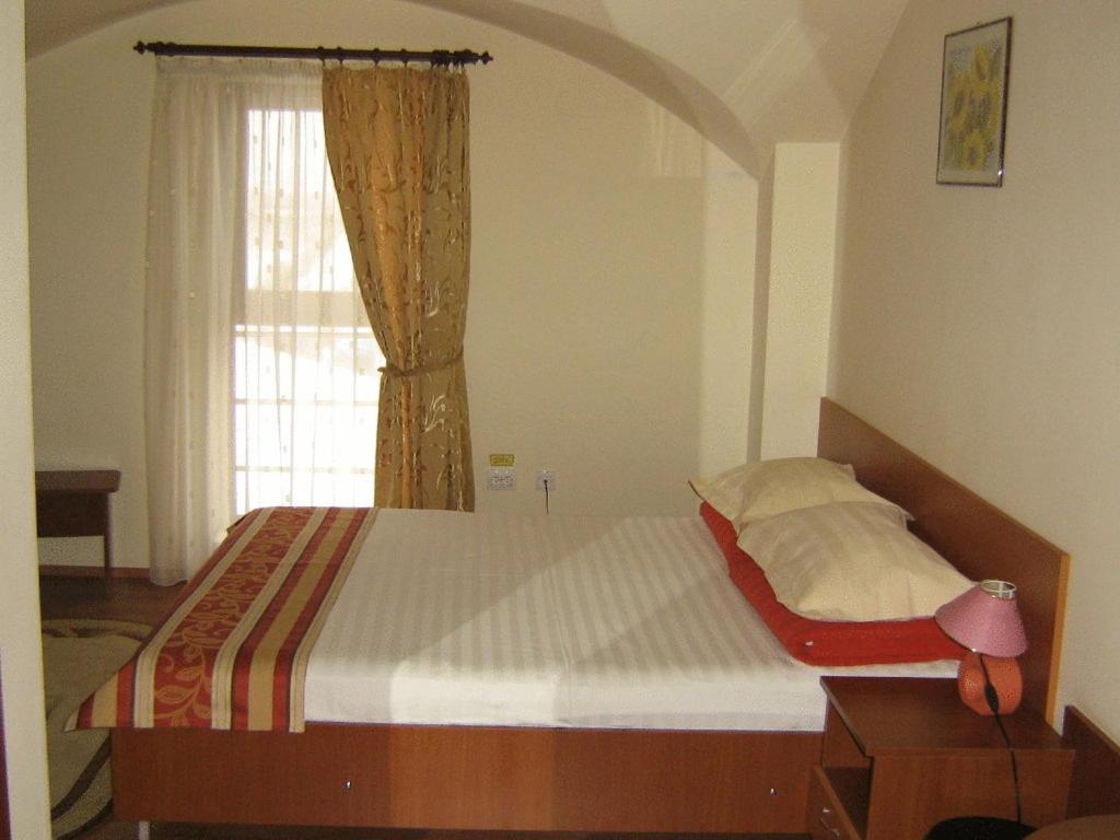 Postel nebo postele na pokoji v ubytování Hotel Transit