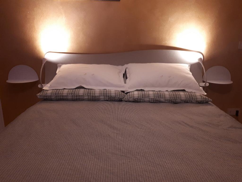 Posteľ alebo postele v izbe v ubytovaní B&B Tre Confini