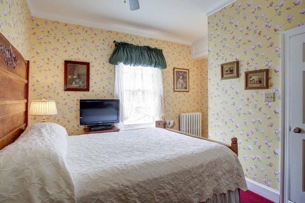 Postel nebo postele na pokoji v ubytování Wilbraham Mansion