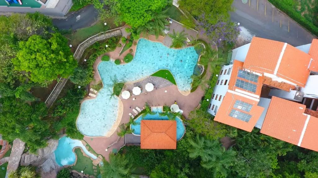 an aerial view of a resort with a swimming pool at Rio Quente Luppi Hotel in Rio Quente