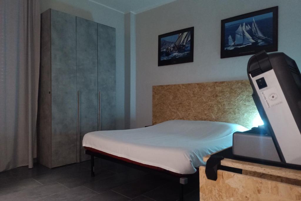 Postel nebo postele na pokoji v ubytování LE MURA Foresteria