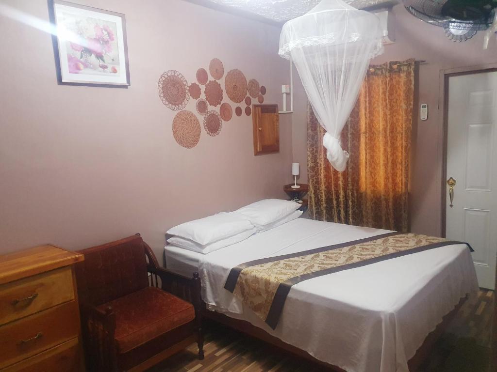 Postel nebo postele na pokoji v ubytování Mesmerize Guest House