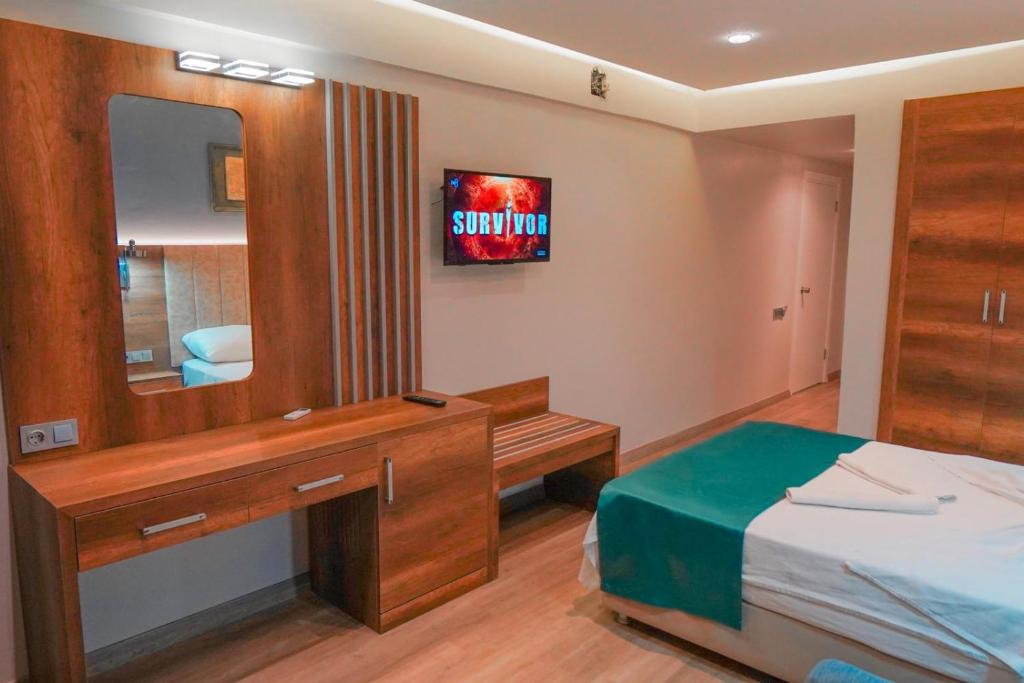Postel nebo postele na pokoji v ubytování Hotel Amore