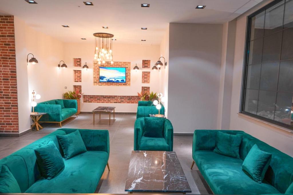 TV a/nebo společenská místnost v ubytování Hotel Amore