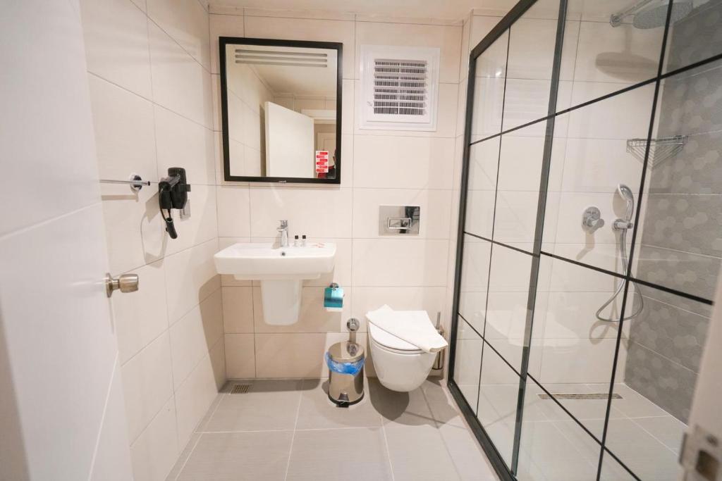 Koupelna v ubytování Hotel Amore