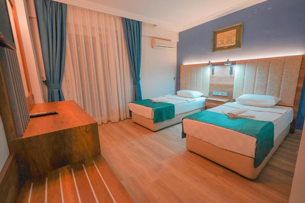 Postel nebo postele na pokoji v ubytování Hotel Amore